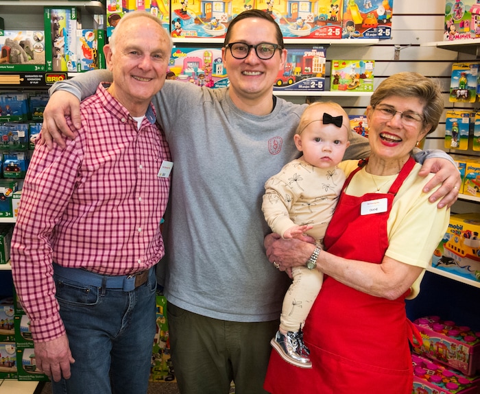 (Rick Egan  |  The Salt Lake Tribune)      Bill Sartain with his son, Casey, and wife Diane and granddaughter Rosie, at the The Tutoring Toy, Thursday, March 22, 2018.