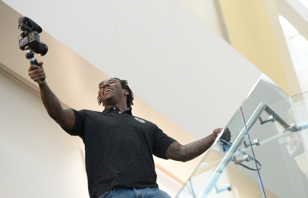 (Francisco Kjolseth  |  The Salt Lake Tribune)  Former BYU football player Jamaal Williams, now with the Green Bay Packers works the selfie camera during media day at the BYU-Broadcasting Building on Friday, June 22, 2018.