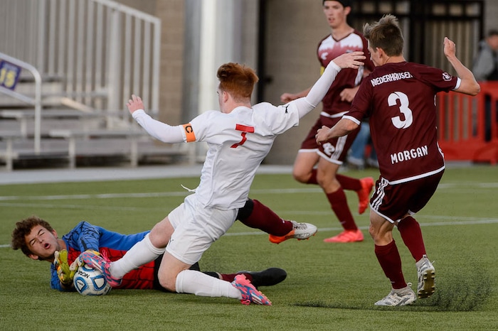 (Trent Nelson | The Salt Lake Tribune)  Judge Memorial faces Morgan High School in the 3A state championship game, Saturday May 12, 2018. Morgan goalkeeper Trek Loveridge stops an attack by Judge Memorial's Joseph Paul.
