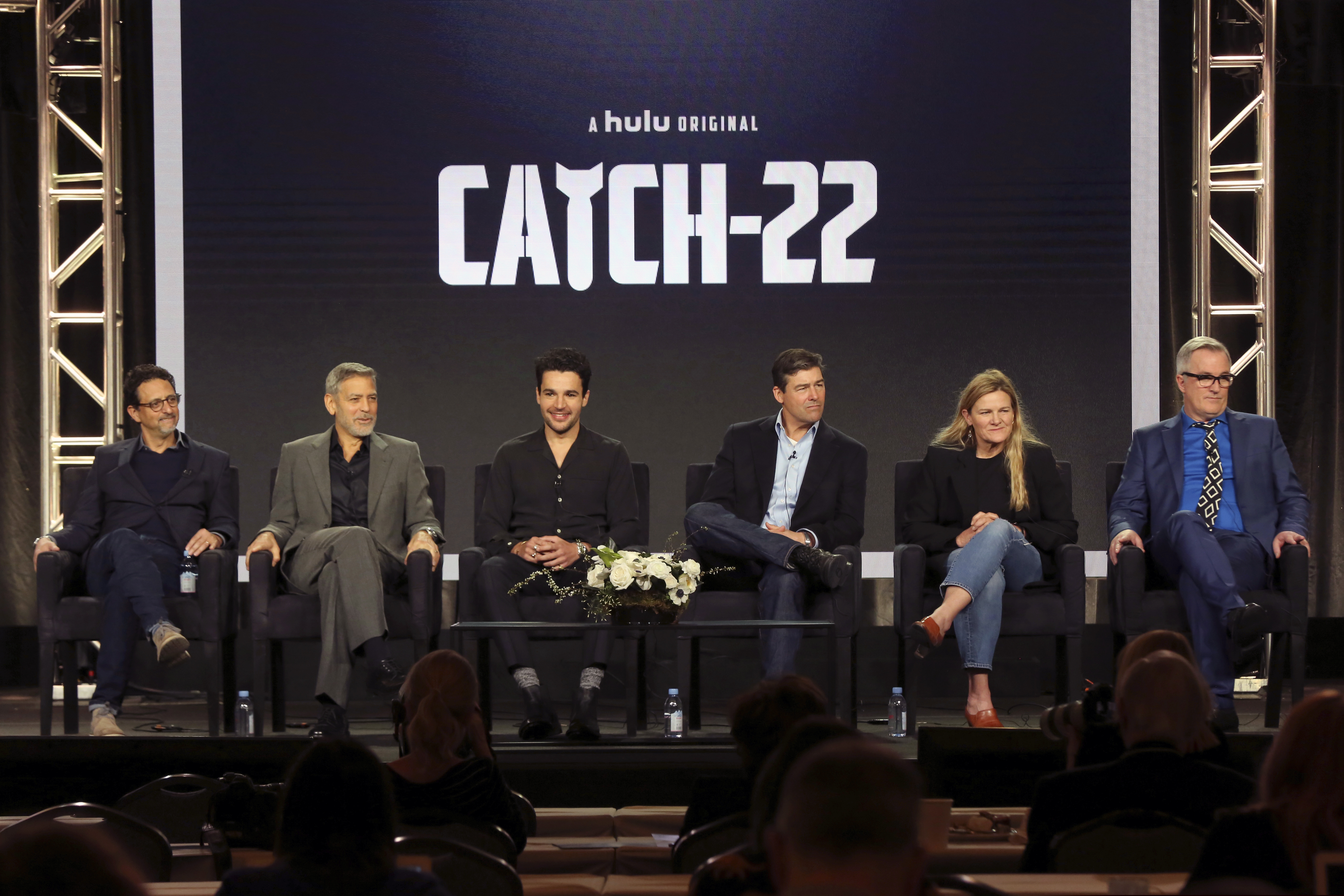 Grant Heslov, from left, George Clooney, Christopher Abbott, Kyle Chandler, Ellen Kuras and Luke Davies participate in the "Catch-22" panel during the Hulu presentation at the Television Critics Association Winter Press Tour at The Langham Huntington on Monday, Feb. 11, 2019, in Pasadena, Calif. (Photo by Willy Sanjuan/Invision/AP)