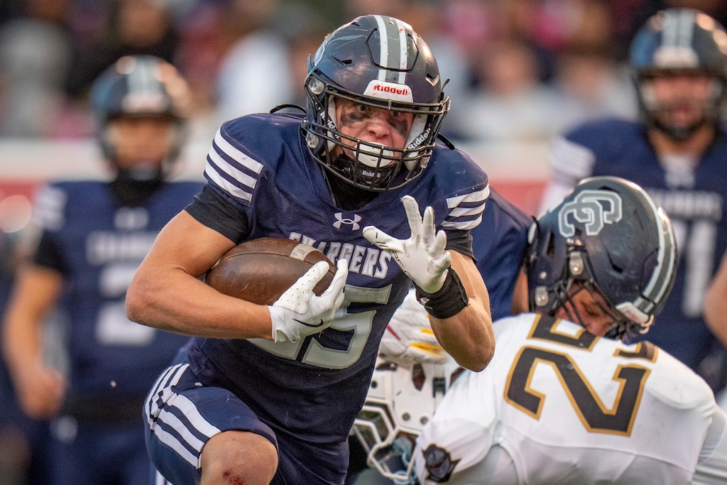 (Rick Egan | The Salt Lake Tribune) Corner Canyon running back Weston Briggs (25) runs for a Chargers touchdown in 6A Championship football action between the Lone Peak Knights and the Corner Canyon Chargers, at Rice-Eccles Stadium, on Thursday, Nov. 20, 2025.