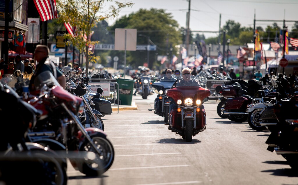 (Grace Pritchett | Rapid City Journal | AP) People ride through downtown Sturgis, S.D., during the 80th annual Sturgis Motorcycle Rally on Monday, Aug. 10, 2020.
