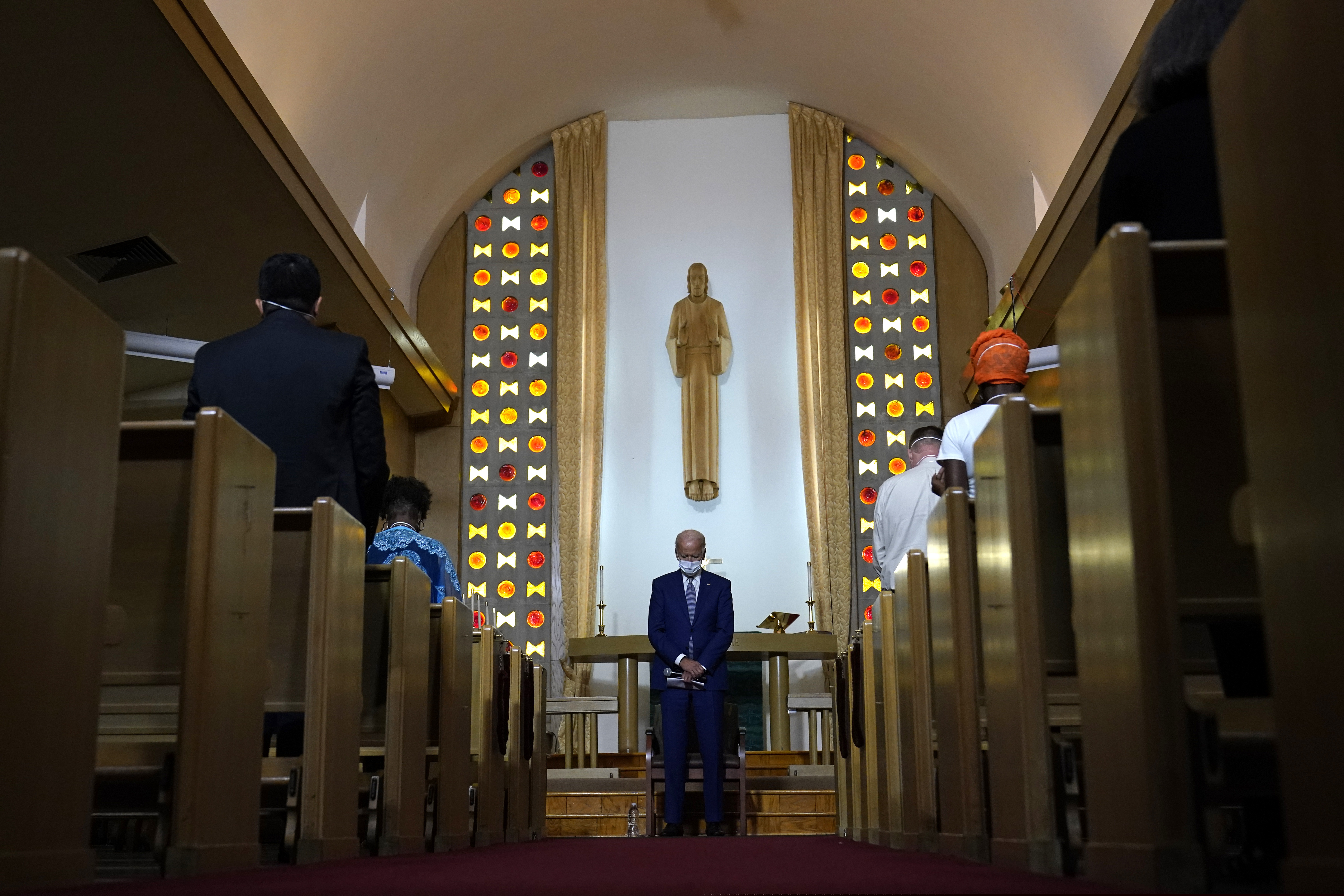 (Carolyn Kaster | AP) Democratic presidential candidate former Vice President Joe Biden bows his head in prayer at Grace Lutheran Church in Kenosha, Wis., Thursday, Sept. 3, 2020.