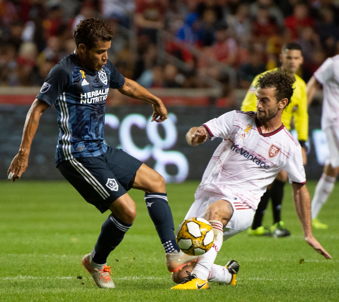 (Rick Egan  |  The Salt Lake Tribune)      Los Angeles Galaxy defender Dave Romney (4) goes after the ball along with Real Salt Lake midfielder Kyle Beckerman (5)), in MLS soccer action between Real Salt Lake and Los Angeles Galaxy at Rio Tinto Stadium, Wednesday, Sept. 25, 2019.