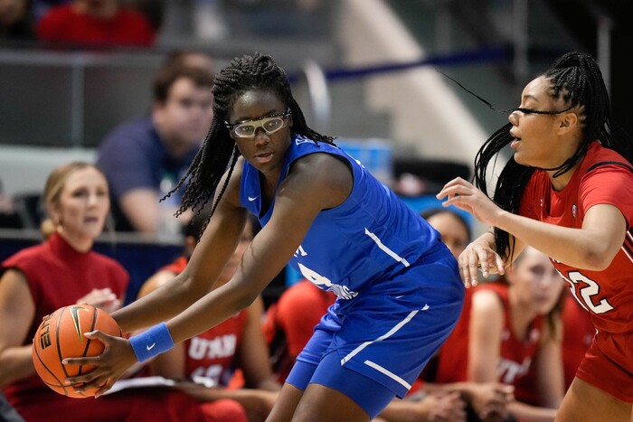 (Francisco Kjolseth | The Salt Lake Tribune) BYU Cougars forward Rose Bubakar (24) looks to make a pass as Utah Utes forward Teya Sidberry (32) defends in basketball action between the Utah Utes and the Brigham Young Cougars, at the Marriott Center in Provo, on Saturday, Dec. 10, 2022.