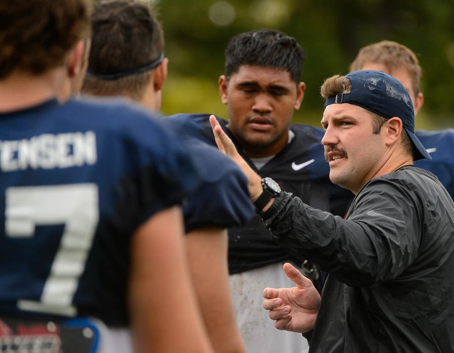 (Trent Nelson | The Salt Lake Tribune)  BYU offensive line coach Ryan Pugh, shown here working with players during preseason camp, says offensive linemen continue to work hard despite some struggles  the past few weeks