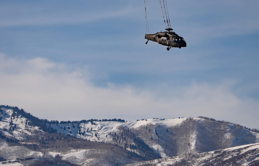 (Francisco Kjolseth | The Salt Lake Tribune) Recovery operations for two Utah Army National Guard UH-60 Black Hawk helicopters involved in a training accident in the Mineral Basin area last week are performed by a CH-47 Chinook helicopter and brought to the Heber Valley Airport on Wednesday, March 2, 2022.