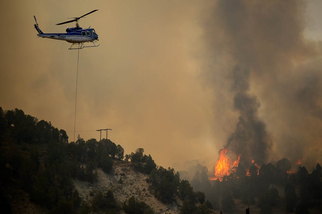 (Trent Nelson | The Salt Lake Tribune) The Coal Hollow Fire burns along Highway 6 in Utah County, Thursday Aug. 9, 2018.