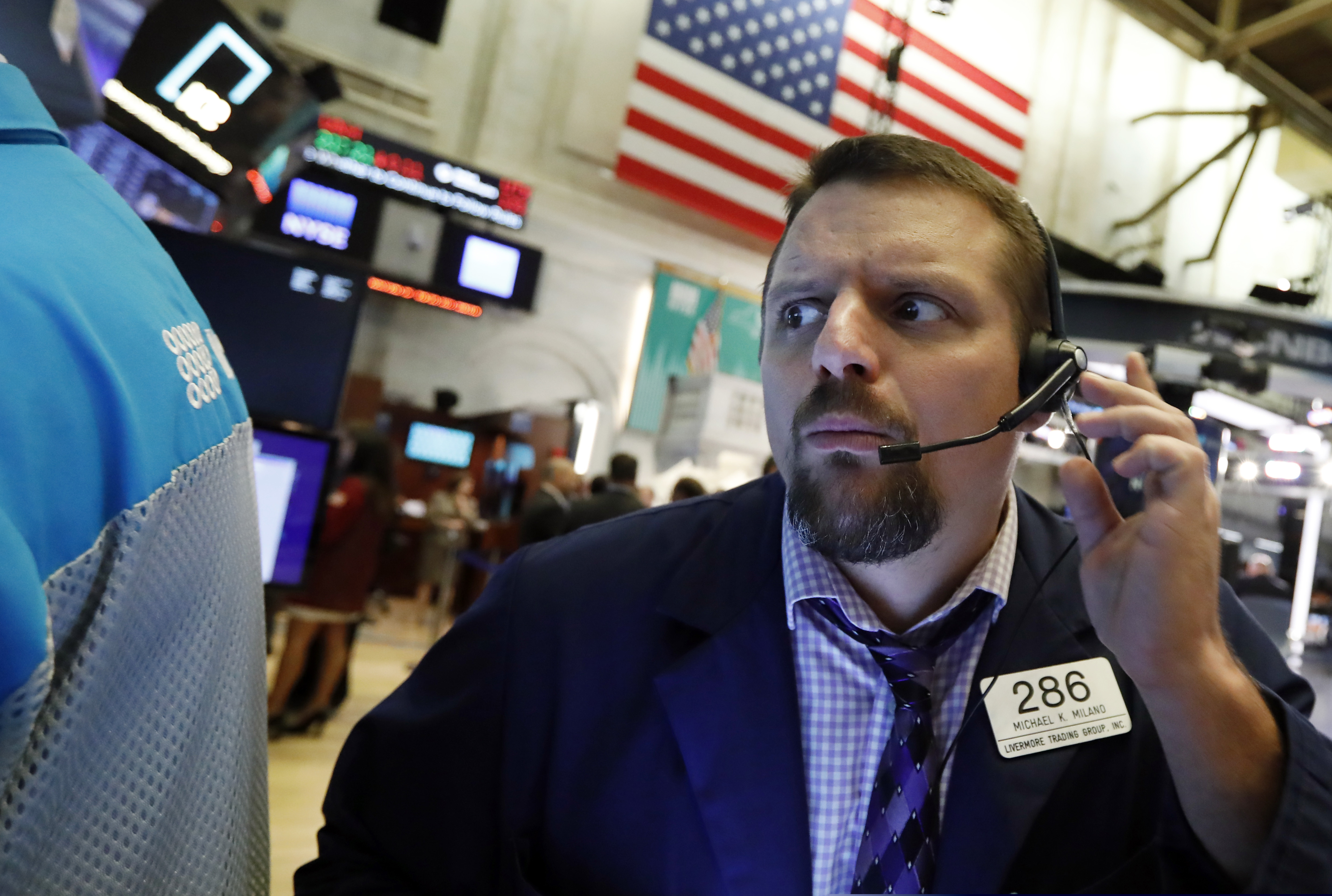 Trader Michael Milano works on the floor of the New York Stock Exchange, Wednesday, Oct. 2, 2019. Stocks are opening lower on Wall Street, following declines overseas, as investors become more worried about the economic outlook. (AP Photo/Richard Drew)