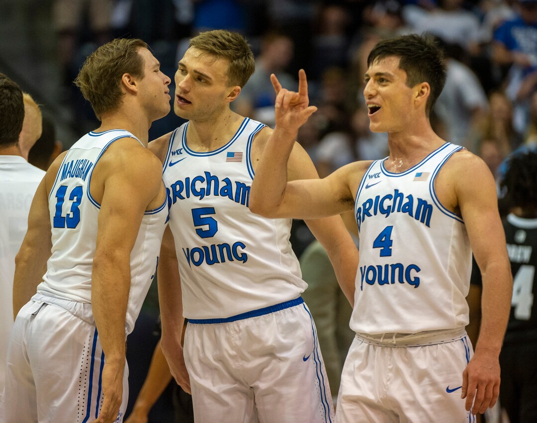 (Rick Egan  |  The Salt Lake Tribune)         Brigham Young Cougars guard Taylor Maughan (13), Cougar guard Jake Toolson (5) and Cougar guard Alex Barcello (4) celebrate as they go to a time out with a huge lead, in basketball action between the Brigham Young Cougars and the Nevada Wolf Pack, at the Marriott Center, in Provo, Saturday, December 10, 2019.