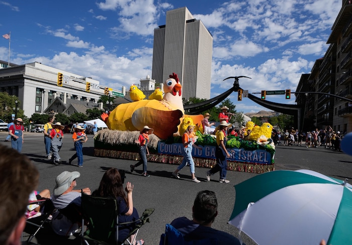 (Francisco Kjolseth | The Salt Lake Tribune) Floats roll down South Temple as people take in the Days of ’47 Parade in Salt Lake City on Saturday, July 23, 2022.