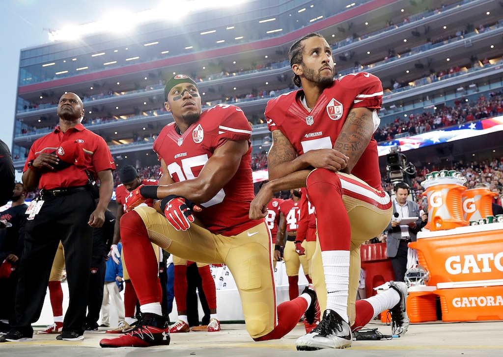 (AP Photo/Marcio Jose Sanchez, File) In this Monday, Sept. 12, 2016, file photo, San Francisco 49ers safety Eric Reid (35) and quarterback Colin Kaepernick (7) kneel during the national anthem before an NFL football game against the Los Angeles Rams in Santa Clara, Calif. NFL owners have approved a new policy aimed at addressing the firestorm over national anthem protests, permitting players to stay in the locker room during the "The Star-Spangled Banner" but requiring them to stand if they come to the field.