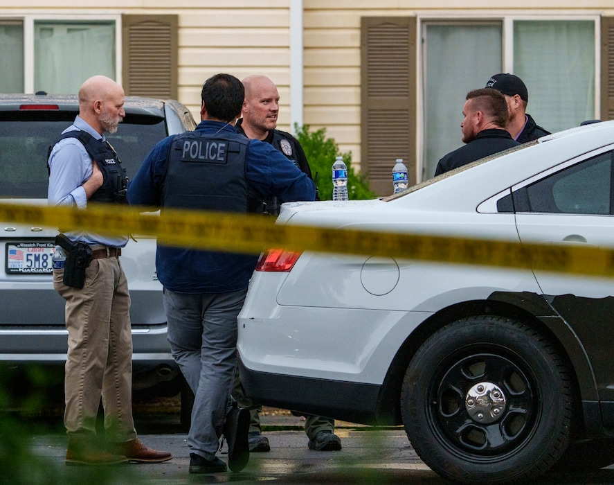 (Leah Hogsten | The Salt Lake Tribune)  Ogden Police department officers investigate the scene of an officer involved shooting at the Washington Park Apartment complex in Ogden, Tuesday, June 6, 2023.