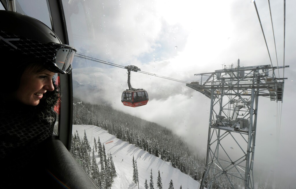 (Gero Breloer | AP file photo)A woman looks out from inside one of the Peak 2 Peak gondola cabins that span the distance between Whistler and Blackcomb mountains in British Columbia, Tuesday, Feb. 16, 2010. Peak 2 Peak is North America's only tri-cable gondola, capable of spanning long distances and carrying up to 4,000 people an hour. The Utah Department of Transportation commissioned a detailed study of such a gondola for Little Cottonwood Canyon as a way to eliminate gridlock on the highway serving Alta and Snowbird.