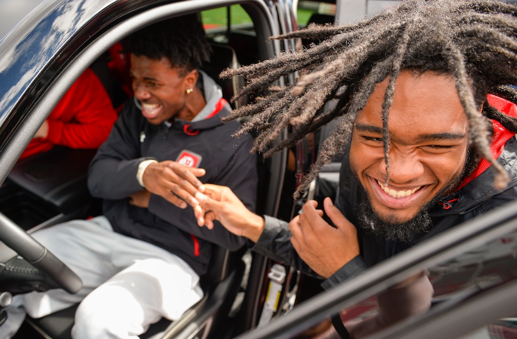 (Chris Samuels | The Salt Lake Tribune) Utah football players react at Rice Eccles Stadium after being given pickup trucks by the Crimson Collective name, image and likeness organization in Salt Lake City, Wednesday, Oct. 4, 2023.
