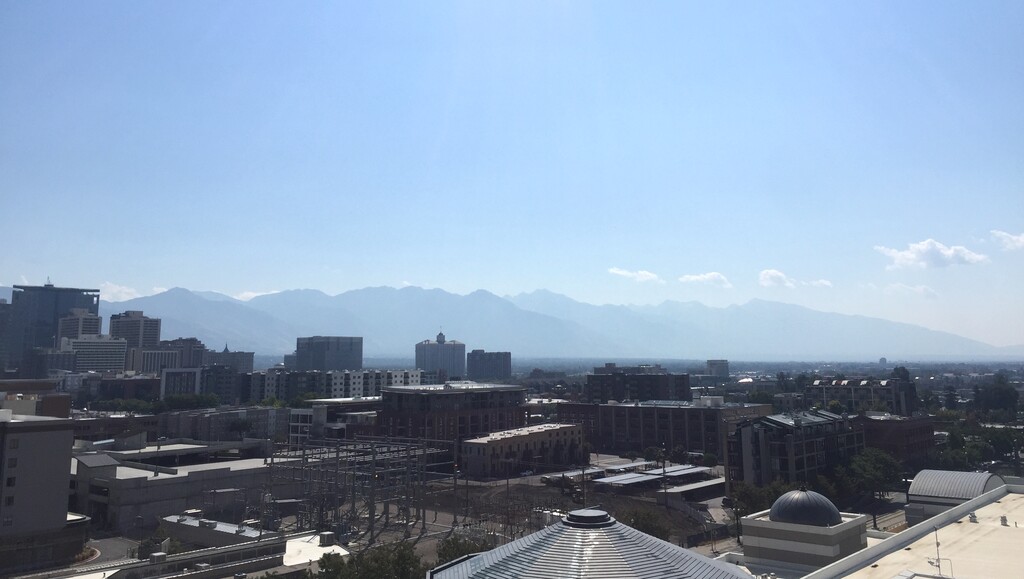 (Scott D. Pierce | The Salt Lake Tribune) A view of the Salt Lake City skyline on Monday, Sept. 9, shows smoke from wildfires in California building up along the Wasatch Front.