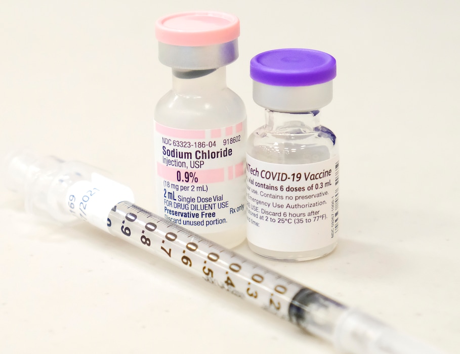 (Leah Hogsten | The Salt Lake Tribune) A vial of saline and the Pfizer COVID19 vaccine.