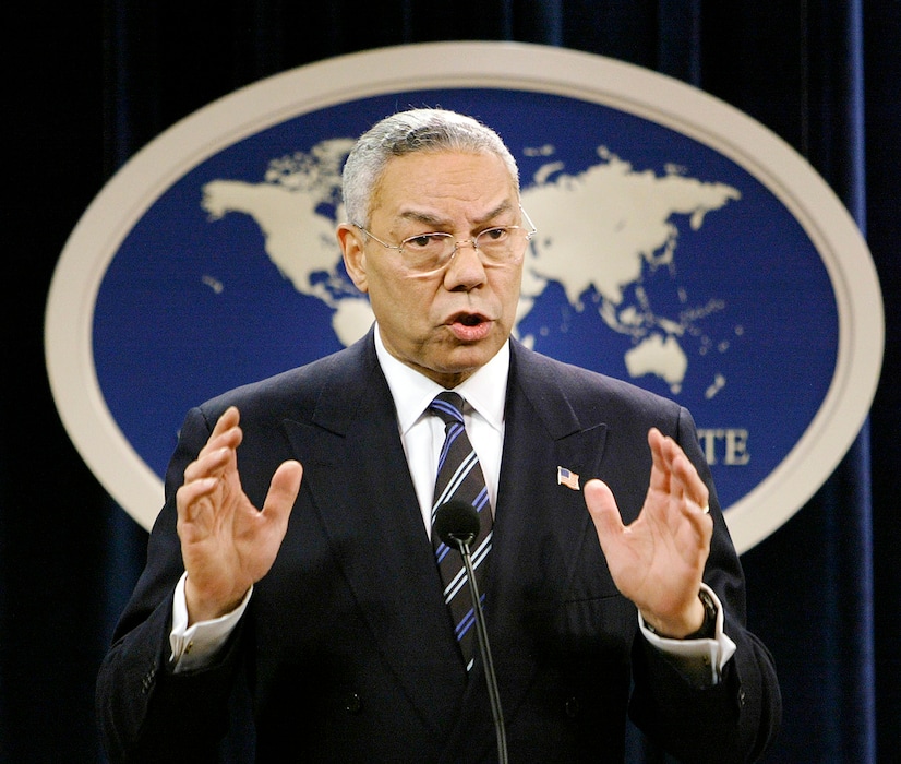 (AP Photo/J. Scott Applewhite) In this Jan. 8, 2004, file photo, then-Secretary of State Colin Powell speaks at a news conference in Washington at the State Department. Powell, who served Democratic and Republican presidents in war and peace but whose sterling reputation was forever stained when he went before the U.N. and made faulty claims to justify the U.S. war in Iraq, has died of COVID-19 complications. He was 84.