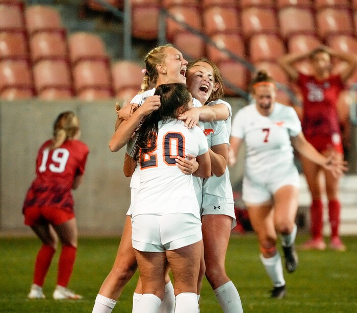 (Leah Hogsten | The Salt Lake Tribune) Mountain Crest  celebrates the win with teammate Summer Sofonia (13) after Crimson Cliffs' goalie Ellie Nielsen could not stop Sofonia's free kick during the 4A State Soccer Championship game between Mountain Crest High School and Crimson Cliffs High School, Oct. 22, 2021 at Rio Tinto Stadium. Mountain Crest defeated Crimson Cliffs 1-0 in double overtime.