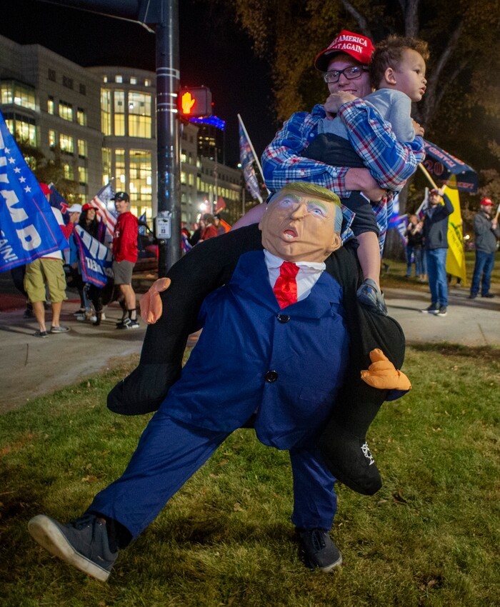 (Rick Egan | The Salt Lake Tribune)  Trump supporters rally at Washington Square, on Monday, Nov. 2, 2020.