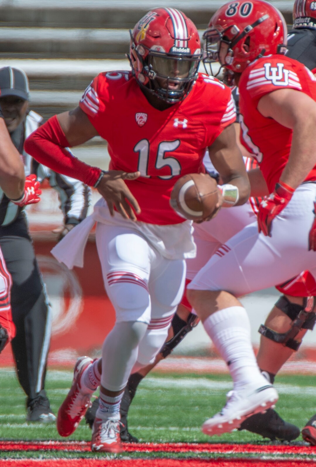 (Rick Egan  |  The Salt Lake Tribune)  Quarterback Jasom Shelley hands off the ball, in Utah's spring Red-White game at Rice-Eccles Stadium, Saturday, April 13, 2019.