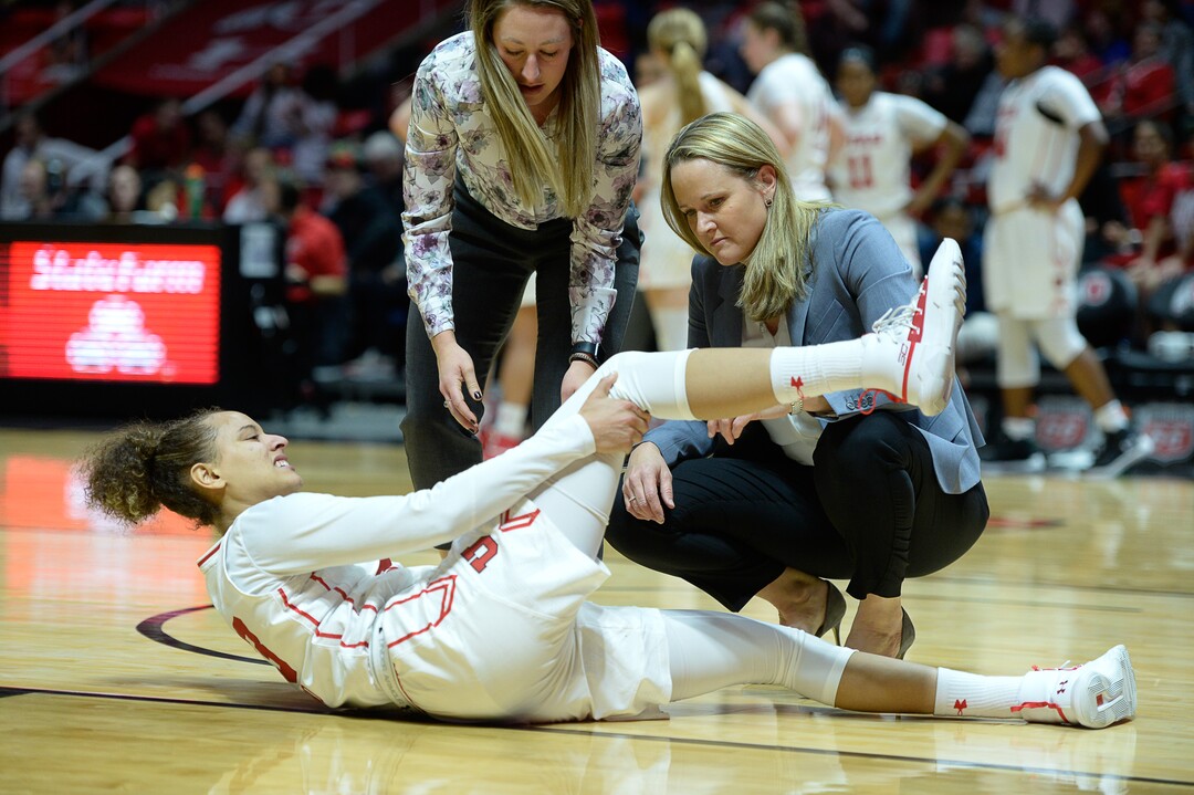 (Francisco Kjolseth  |  The Salt Lake Tribune)  Utah Utes guard/forward Daneesha Provo (23) takes a hard hit that injures her knee while battling ASU in Utes' Pac-12 home opener at the Jon M Huntsman Center on Friday, Jan. 4, 2019. Off to one of their best starts in team history, their twelve in a row winning streak came to an end losing to the Sun Devils 63-65.