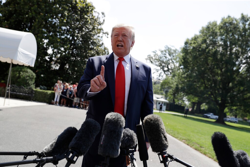 (Evan Vucci | AP) President Donald Trump talks to reporters on the South Lawn of the White House before departing for his Bedminster, N.J., golf club, Friday, July 5, 2019, in Washington.