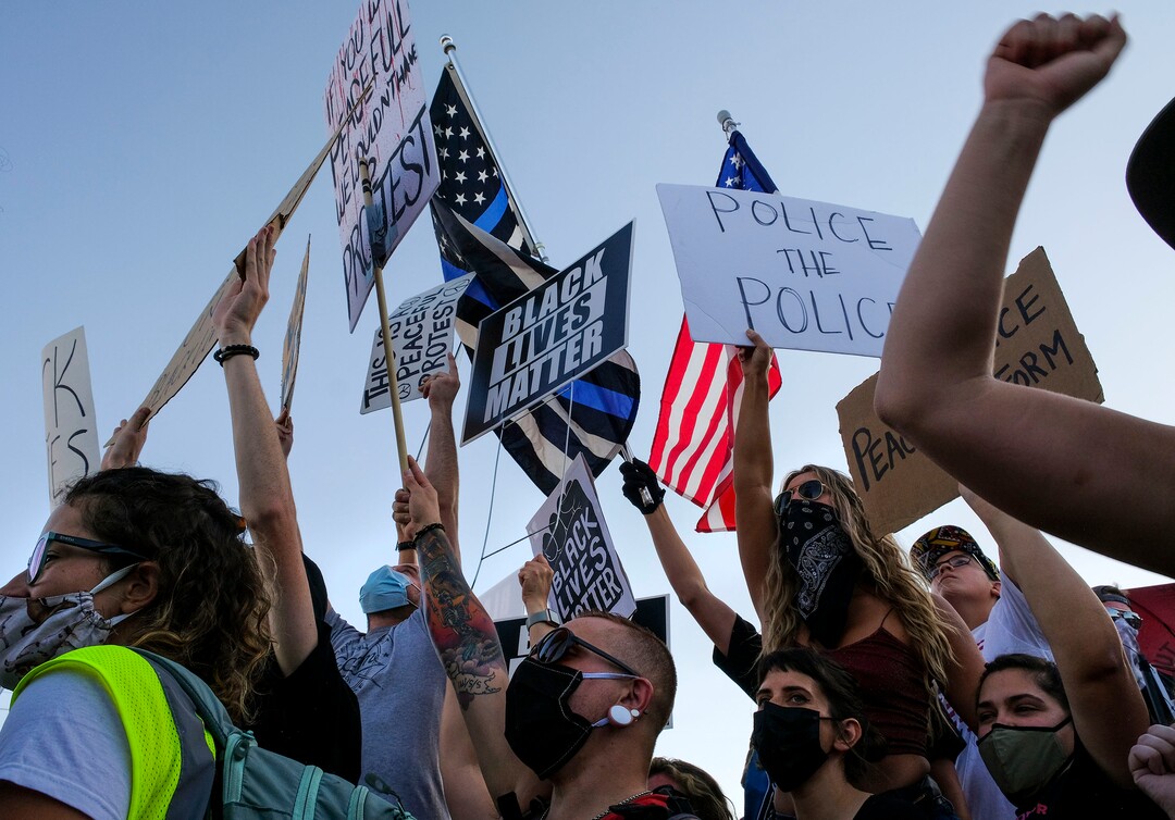 (Leah Hogsten  |  The Salt Lake Tribune) Supporters for Black Lives Matter mix with signs for Blue Lives Matter supporters. Five days after after nine protesters were arrested during a peaceful rally in memory of Zane James that turned into a violent clash with Cottonwood Heights officers, demonstrators gathered outside the police station Friday to denounce CHPD's actions and its officers for inciting the violence.