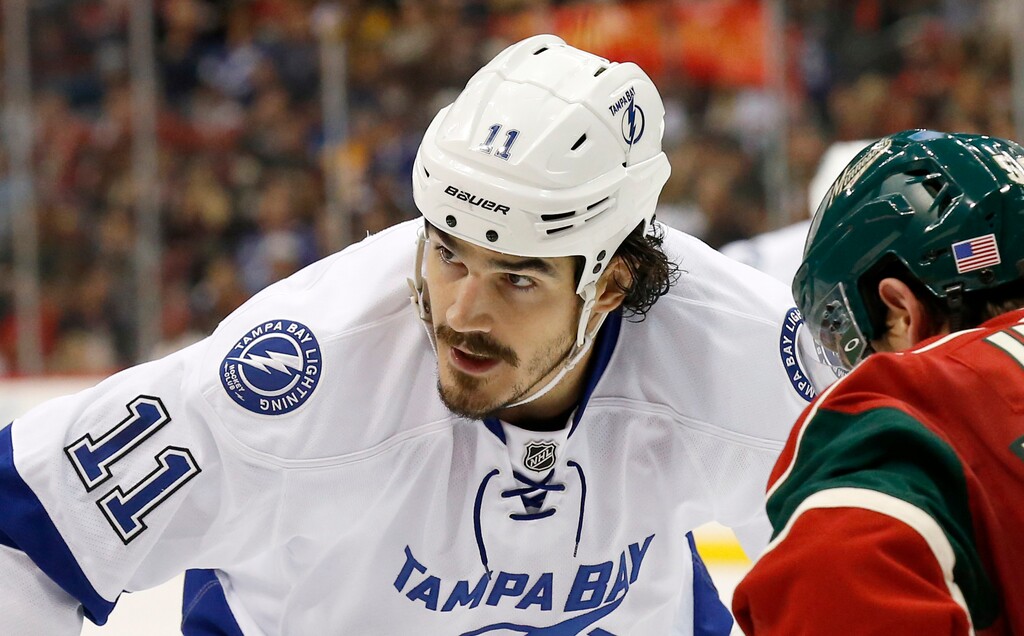 FILE - In this Nov. 7, 2015, file photo, Tampa Bay Lightning center Brian Boyle (11) gets into position for a face-off against Minnesota Wild left wing Erik Haula (56) during the second period of an NHL hockey game in St. Paul, Minn. Boyle, 32, who signed a $5.5 million, two-year deal with the New Jersey Devils in July, has been diagnosed with chronic myeloid leukemia, a type of bone-marrow cancer that the team’s doctor says can be treated with medication, the Devils announced Tuesday, Sept. 19, 2017. (AP Photo/Ann Heisenfelt, File)