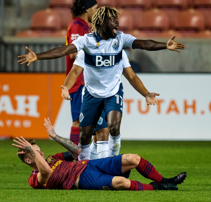 (Rick Egan  |  The Salt Lake Tribune)   Vancouver Whitecaps midfielder Leonard Owusu (17) reacts after colliding with Real Salt Lake midfielder Albert Rusnak (11), in MLS soccer action between Real Salt Lake and the Vancouver Whitecaps at Rio Tinto Stadium on Saturday, Sept. 19, 2020.

 
