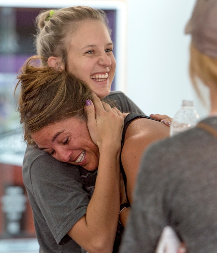 (Leah Hogsten  |  The Salt Lake Tribune) Relief washes over Uintah fire evacuee Kristen Samuels as she is hugged by her daughter Madison after it was confirmed that the family home had not burned down. The Uintah Fire is still burning through the town of Uintah and pockets of South Weber, as well as the unincorporated subdivision of Uintah Highlands.
