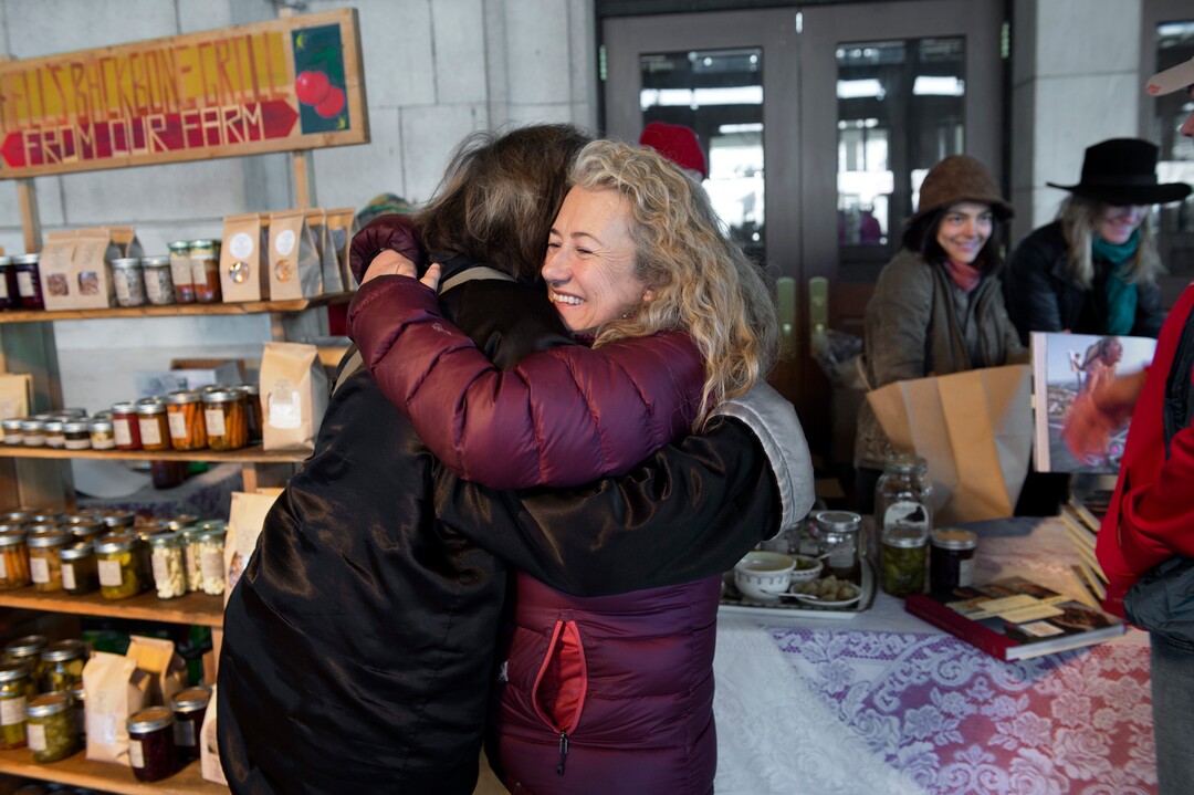 (Scott Sommerdorf   |  The Salt Lake Tribune)   Blake Spalding, co-owner of Hell's Backbone Grill in Boulder, hugs friend Mary Brown Malouf at the Winter Market at the Rio Grande Depot, Saturday, December 9, 2017.  
