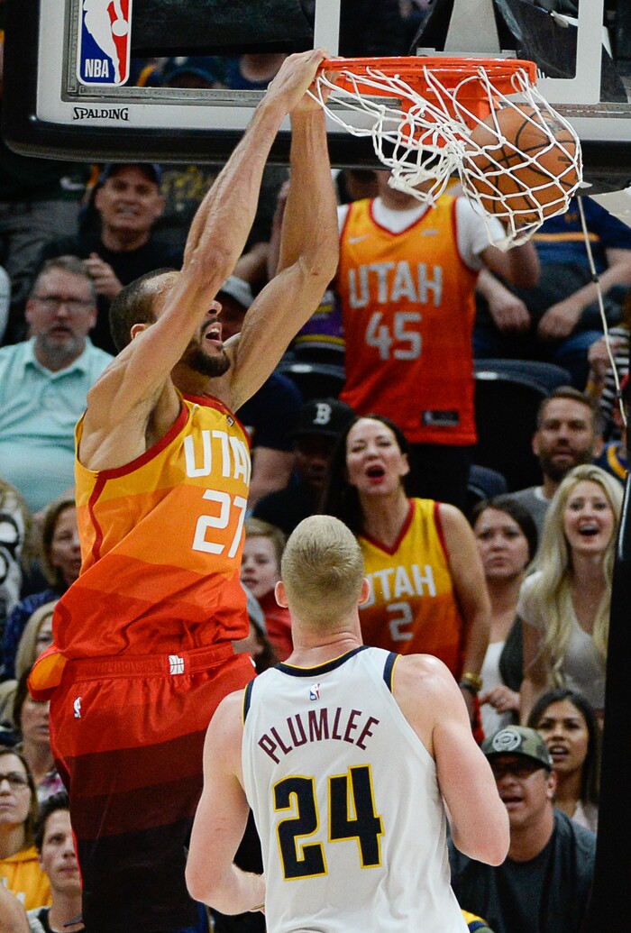(Francisco Kjolseth  |  The Salt Lake Tribune)  Utah Jazz center Rudy Gobert (27) dunks over Denver Nuggets forward Mason Plumlee (24) as the Utah Jazz host the Denver Nuggets in their NBA game at Vivint Smart Home Arena Tuesday, April 9, 2019, in Salt Lake City.