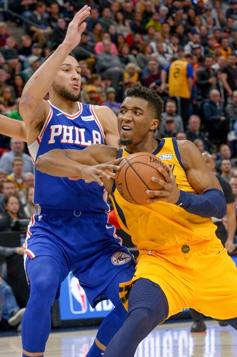 Leah Hogsten  |  The Salt Lake Tribune Utah Jazz guard Donovan Mitchell (45) drives the lane past Philadelphia 76ers guard Ben Simmons (25) as the Utah Jazz host the Philadelphia 76ers at Vivint Smart Home Arena, Thursday, December 27, 2018. 