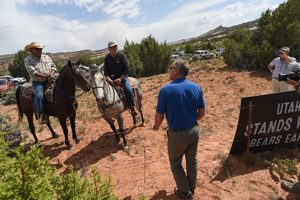 (Francisco Kjolseth | The Salt Lake Tribune) Interior Secretary Ryan Zinke speaks with Leroy Teeasyaton, left, and Willy Grayeyes of Utah Dine Bikeyah following a short hike to Butler Wash Indian Ruins by the secretary and members of the Utah delegation during a tour of the Bears Ears National Monument on Monday, May 8, 2017.