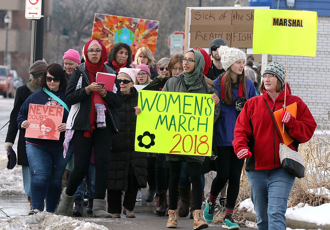 Hundreds march Saturday, Jan. 20, 2018 through downtown Eau Claire, Wis. as part of the Women's March Wisconsin Day of Action. The march followed a rally at Phoenix Park and was a companion event to marches in Milwaukee and Green Bay. (Steve Kinderman/The Eau Claire Leader-Telegram via AP)