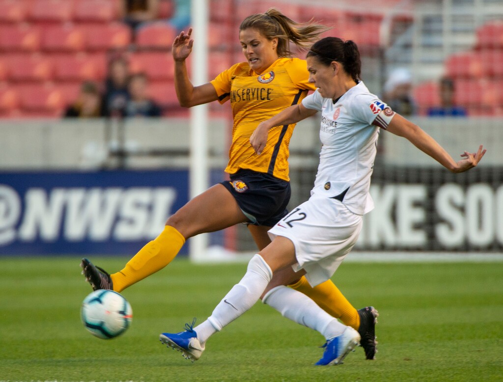 (Rick Egan  |  The Salt Lake Tribune)    Utah Royals FC forward Katie Stengel (24) goes for the ball along with Portland Thorns FC forward Christine Sinclair (12), in Soccer action between Utah Royals FC and Portland Thorns FC, in Sandy, Friday, July 19, 2019.