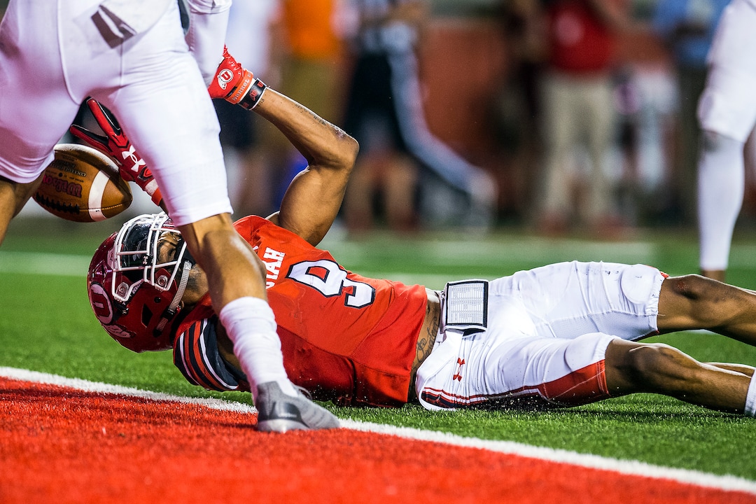 (Chris Detrick  |  The Salt Lake Tribune)  Utah Utes wide receiver Darren Carrington (9) comes up short of a touchdown while being guarded by North Dakota Fighting Hawks defensive back Torrey Hunt (16) during the game at Rice-Eccles Stadium Thursday, August 31, 2017. Utah Utes defeated North Dakota Fighting Hawks 37-16.