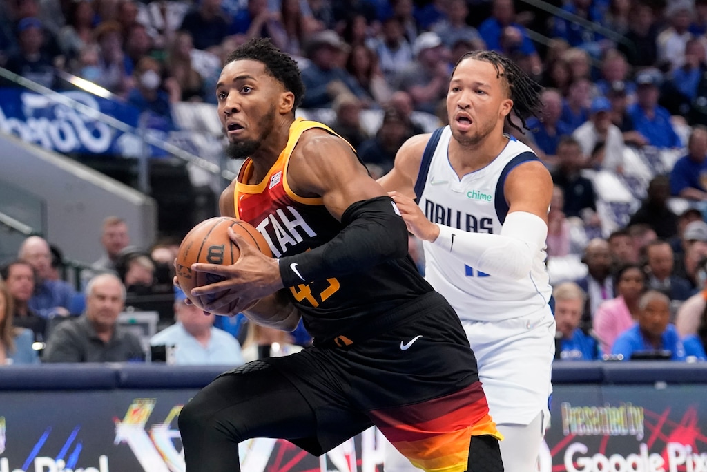Utah Jazz guard Donovan Mitchell (45) drives to the basket past Dallas Mavericks guard Jalen Brunson, right, in the first half of Game 2 of an NBA basketball first-round playoff series, Monday, April 18, 2022, in Dallas. (AP Photo/Tony Gutierrez)