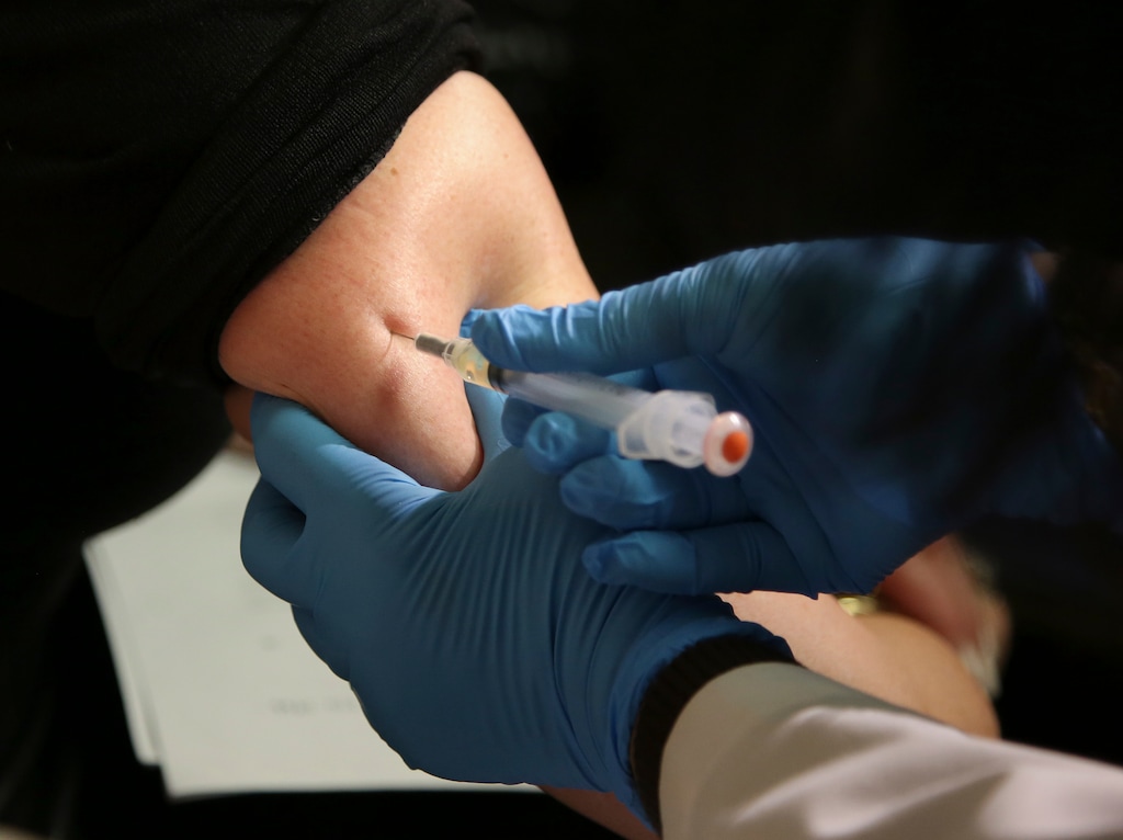 (Seth Wenig | The Associated Press) In this March 27, 2019 file photo, a woman receives a measles, mumps and rubella vaccine.