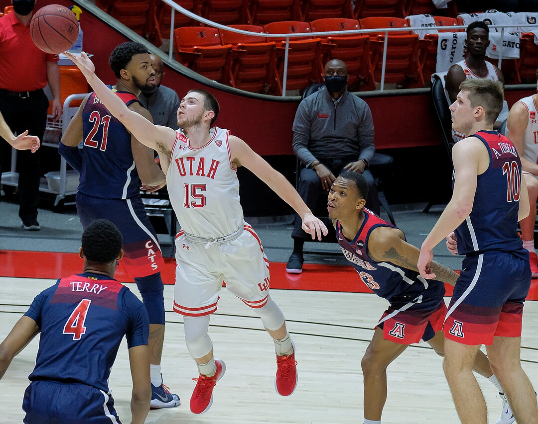 (Leah Hogsten | The Salt Lake Tribune) Utah Utes guard Rylan Jones (15) rises to the net unguarded as the University of Utah host the Arizona Wildcats, Feb. 4, 2021 at the Jon M. Huntsman Arena.