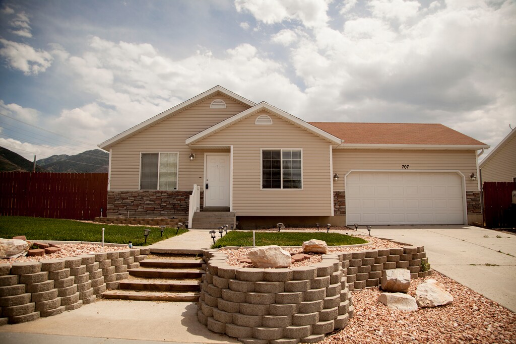(Stella Yu |  The Salt Lake Tribune) This 2,252-square-foot rambler home in Tooele comes with four bedrooms, three baths, a family room, a kitchen with a bar. The backyard provides room for RV parking, with garden beds on the side yard. 