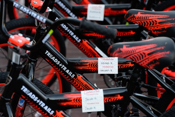 (Francisco Kjolseth  |  The Salt Lake Tribune)  Volunteers and workers at Squatter's Pub Brewery assemble 80 bicycles for kids on Tuesday, May 29, 2018. The bikes will be given away to 1st and 2nd graders at Washington Elementary on Wednesday as part of a program backed by the Can'd Aid Foundation.