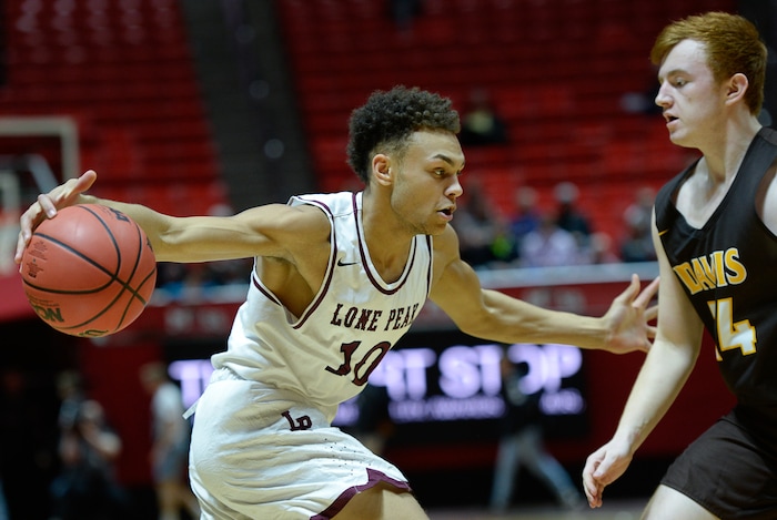 (Francisco Kjolseth  |  The Salt Lake Tribune)  Davis vs Lone Peak, 6A State high school basketball tournament at the Huntsman Center in Salt Lake City, Thursday March 1, 2018. Richard Mills (10) battles Davis. 