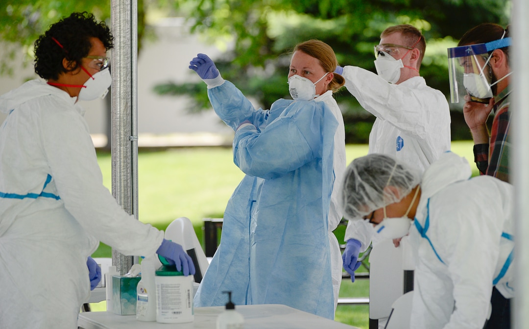 (Francisco Kjolseth  |  The Salt Lake Tribune) The Utah Department of Health suits up as it prepares to test staff of West Jordan Care Center for the coronavirus on Thursday, May 21, 2020. The testing is part of a plan to test staff at all long-term care facilities, with centers for memory patients and the intellectually disabled receiving priority.