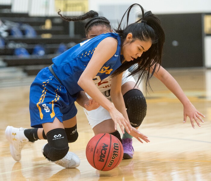 (Rick Egan  |  The Salt Lake Tribune)   Tasiah Little (21) San Juan, goes for a loose ball, along with Victoria Garcia (40) Judge Memorial, in 3A Women's basketball State playoff action Judge Memorial vs. San Juan, in Heber City, Friday, Feb. 16, 2018.