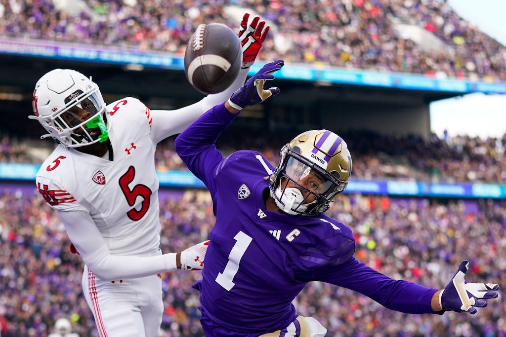 Washington wide receiver Rome Odunze (1) can't make a catch in the end zone against Utah cornerback Zemaiah Vaughn (5) during the first half of an NCAA college football game Saturday, Nov. 11, 2023, in Seattle. (AP Photo/Lindsey Wasson)