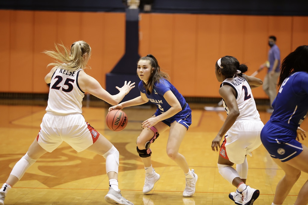 (Jaren Wilkey | BYU Photo) BYU's Shaylee Gonzales (in blue) goes up against Arizona's Cate Reese on a late-game drive.