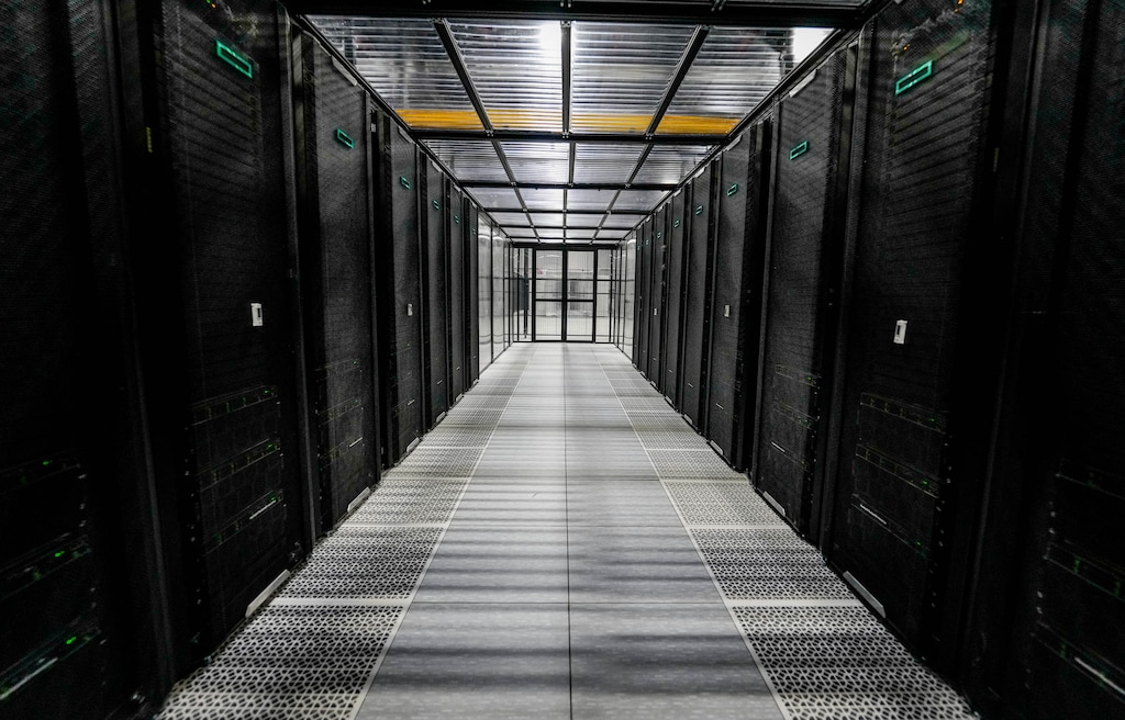 (Francisco Kjolseth | The Salt Lake Tribune) A cold isle containment cage houses what is ranked among the world’s fastest and greenest supercomputers, in a data center facility in Bluffdale, pictured Tuesday, Aug. 18, 2026.