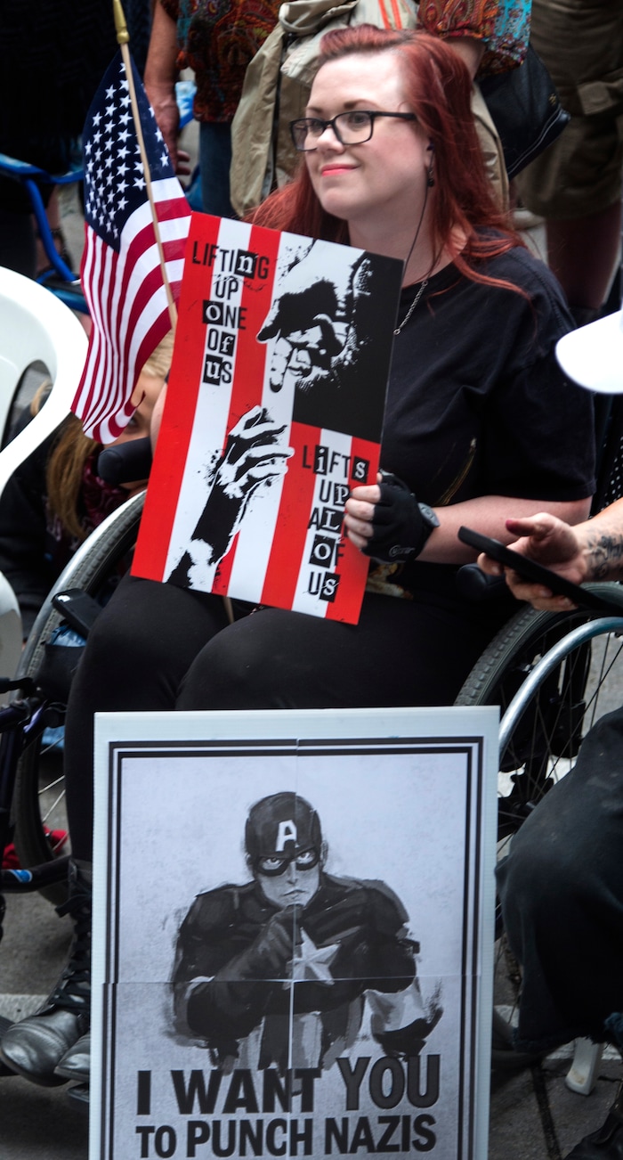 (Rick Egan  |  The Salt Lake Tribune)  Stacy Stanford, listens to the speeches at the Charlottesville Va. solidarity rally, hosted by Utah League of Native American Voters, at the City and County Building, Monday, August 14, 2017.


